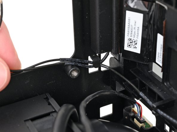 Pull the antenna cables into their metal hook in the chassis.