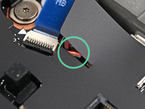 The red status LED near the right Expansion Card slots should blink continuously. If this LED isn't blinking, the laptop isn't receiving power correctly—try another USB-C port.