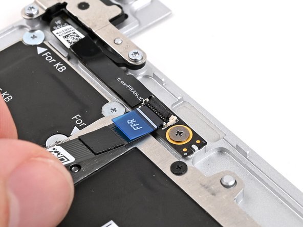 Slide the Fingerprint Reader Cable straight into its socket.