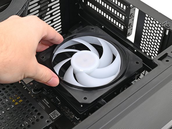 Lay the fan on top of the heatsink.