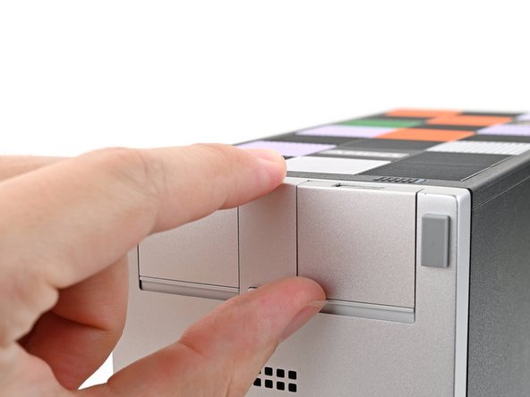 Push up on the lip of the Expansion Card with your fingers.