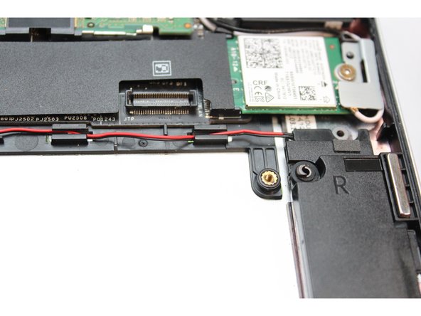 Route the wires through each of the wire routers. You can use your fingernail to secure the wires in place.