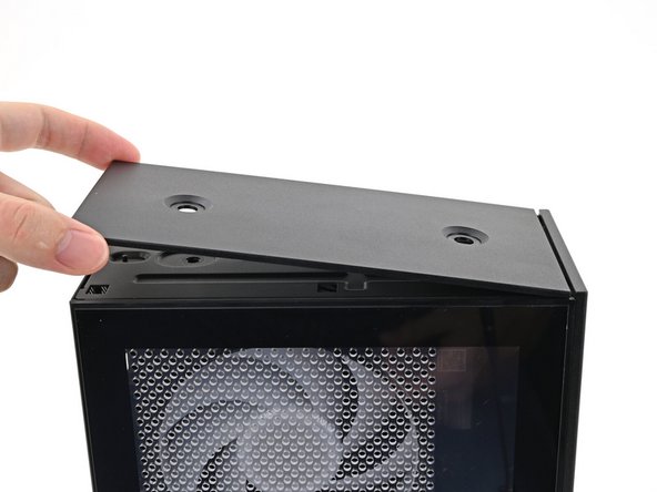 While holding the Top Panel at a slight downward angle, slide it across the top of the chassis (from rear to front) until you feel its clips catch.