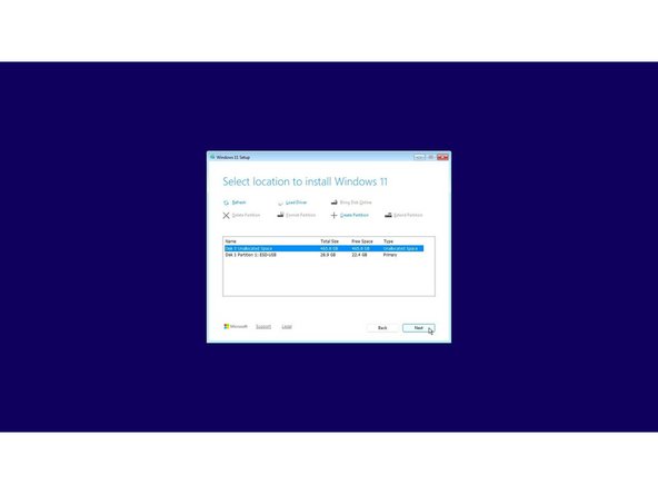 The cursor may not appear until after swiping on the touchpad for a few seconds.  If the cursor still doesn't appear, hard power down the laptop by holding the power button until the system shuts off.  Wait 15 seconds, and power on again.  You can also use the Tab and Enter keys on the keyboard or an external USB mouse to complete the installation.