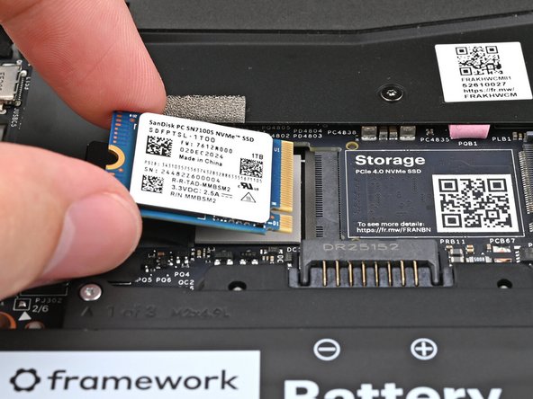 Hold the SSD by its edges. Don't touch the gold contacts with your fingers. If you do, wipe the contacts with a clean, lint-free cloth to remove any finger oils.