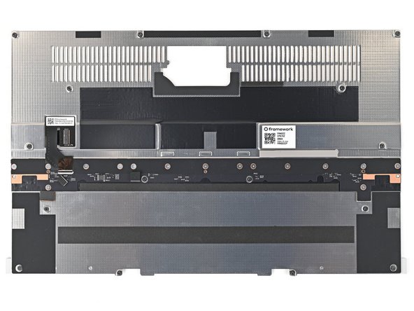 Use your Framework Screwdriver to remove the fifteen 1.4 mm‑long Phillips screws securing the Input Module Connector Board.