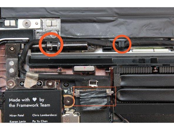 Route the Display Cable through the channel in the Top Cover, over the left hinge, and plug it back into the Mainboard.