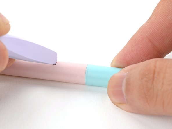 As you depress the clip, use your fingers to pull the battery straight out of the back of the Stylus to remove it.