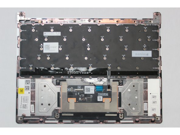 Gently place the new Keyboard into the Input Cover by aligning the edges of the keyboard with the Input Cover as indicated in the first image. The keys should be facing down.