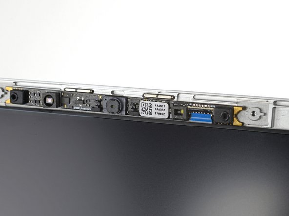 Use tweezers to gently bend the webcam cable away from the screen frame.