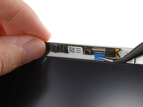 Reconnecting the webcam module is a little tricky. If you're having difficulty, you can reposition the display to give the webcam cable more slack.