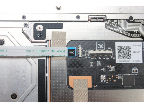 Flip the black latch down to secure the cable.