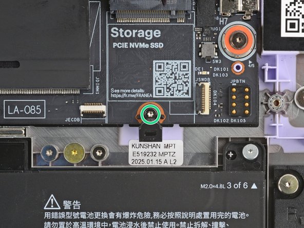 Use your Framework Screwdriver to remove the 3.5 mm‑long T5 Torx screw securing the SSD clip.
