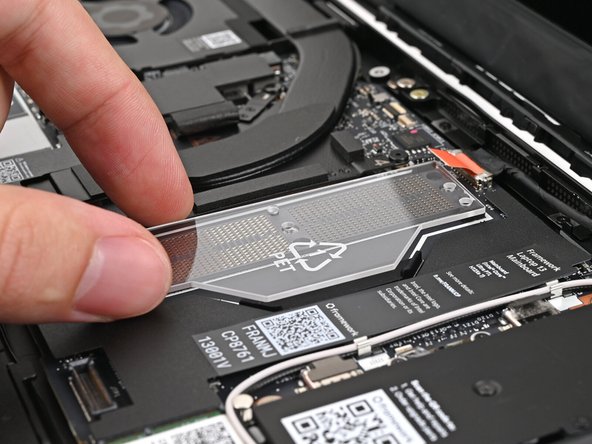 If present - remove the LPCAMM2 Memory Spacer and recycle it.