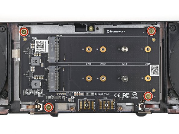 Use your Framework Screwdriver to partially install the four 3.6 mm‑long screws securing the Dual M.2 Adapter—only screw them in a few turns.