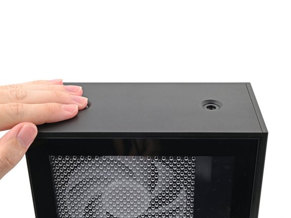 Slide the Top Panel towards the rear of the computer to release the clips securing it to the chassis.