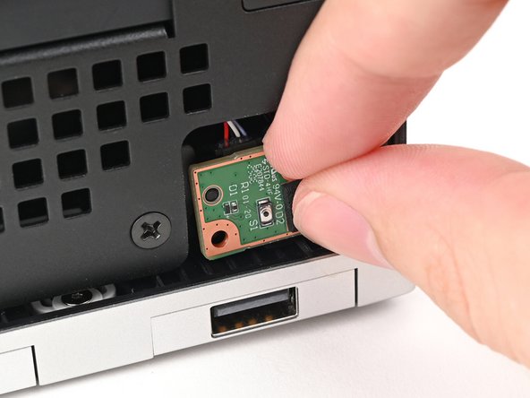 Place the board into its slot in the Desktop so the alignment peg is threaded through its hole in the board.
