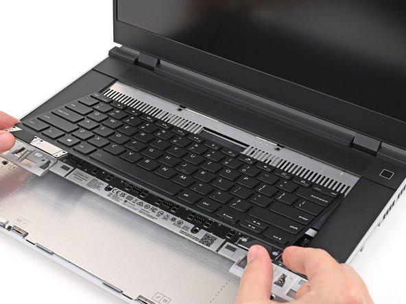 Hold the Keyboard at a slight downward angle and align it with two of the dotted lines on the Mid Plate.