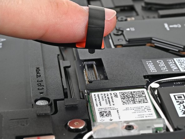 Lift up to disconnect the Touchpad Cable from the Mainboard.