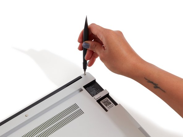 Close the Framework Laptop and turn it upside down to reveal fasteners on the Bottom Cover.