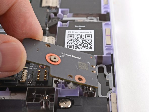 Use your fingers to lift and remove the Power Button Board.