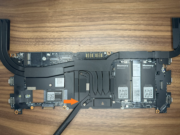 Using the spudger side of the Framework screwdriver, pry the CPU Heatsink away from the mainboard.