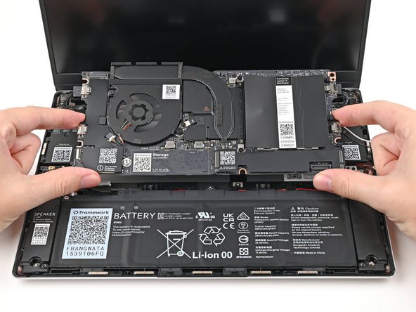 Lift the Mainboard off its alignment pegs and remove it.