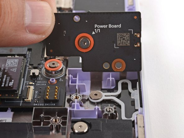 Use your fingers to lift and remove the Power Button Board.