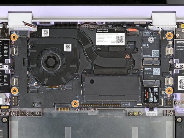 Use your Framework Screwdriver to loosen the five captive T5 Torx screws securing the Mainboard.