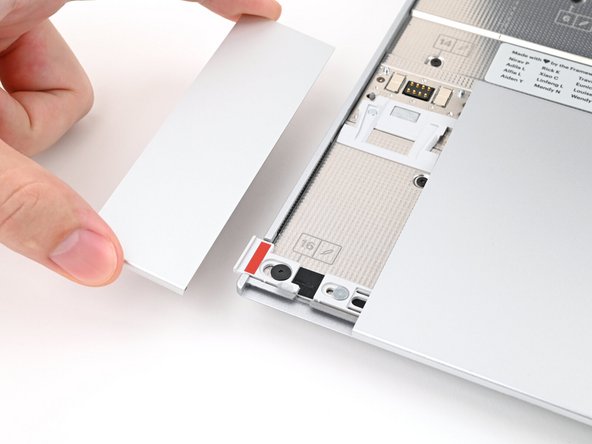 Repeat the previous two steps to remove the other Touchpad Spacer.