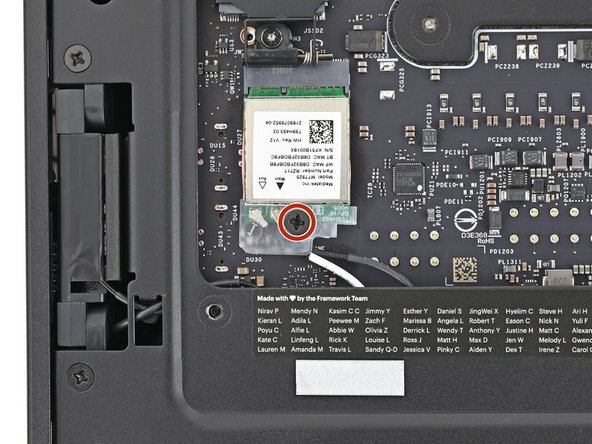 Use your Framework Desktop Screwdriver to install the screw securing the Wi-Fi module.