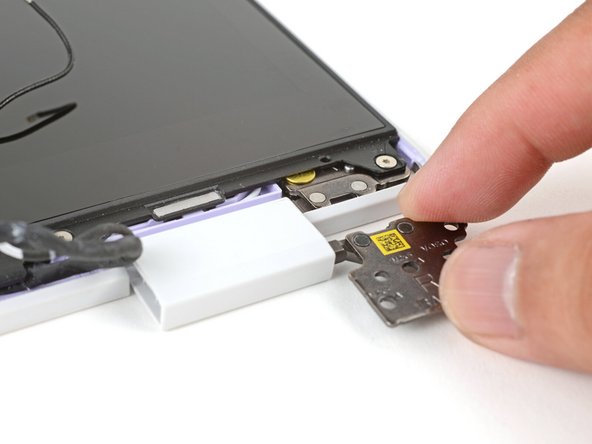 Use your fingers to twist both hinge plates back down so they lay flat on your work surface.