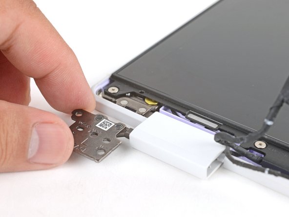 Use your fingers to twist both hinge plates back down so they lay flat on your work surface.