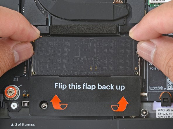 Use your fingers to grab the memory module by its edges.