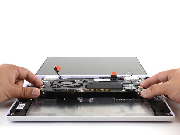 Make sure you've removed all Expansion Cards. Installed cards will hold the Mainboard in place.