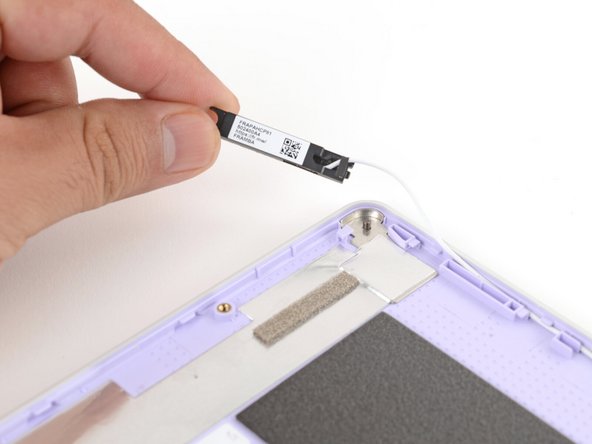 Use your fingers to lift the right antenna away from the Top Cover.