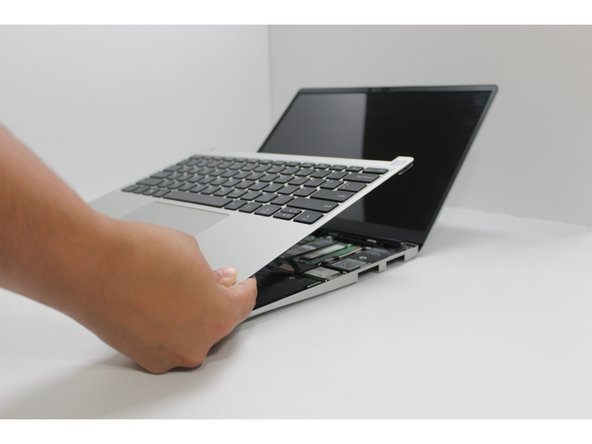 The bottom right corner of the Input Cover lifts up when the five fasteners are properly unscrewed from the previous step. You should not have to use any excessive force to remove the Input Cover.