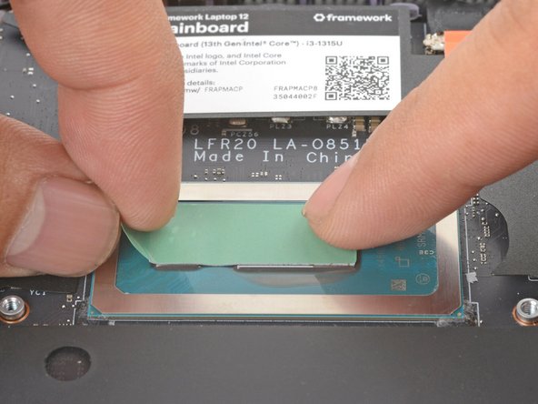 Place the thermal pad over the processor, making sure it covers both raised blocks.