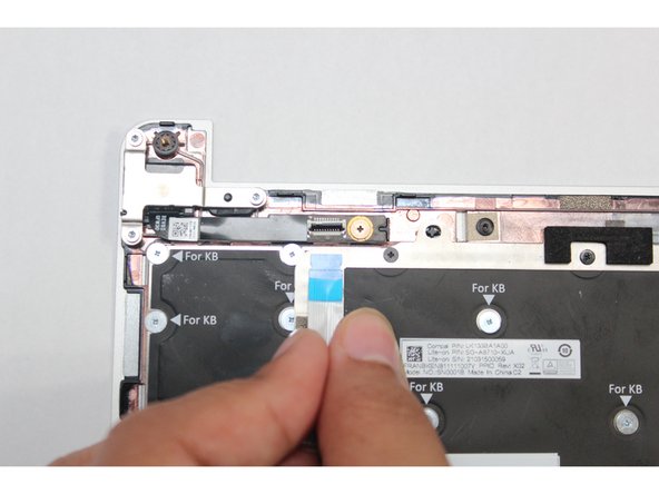 Connect the Fingerprint Cable into the Fingerprint Module. Make sure the black latch is flipped up so that you can slide the cable into the connector.