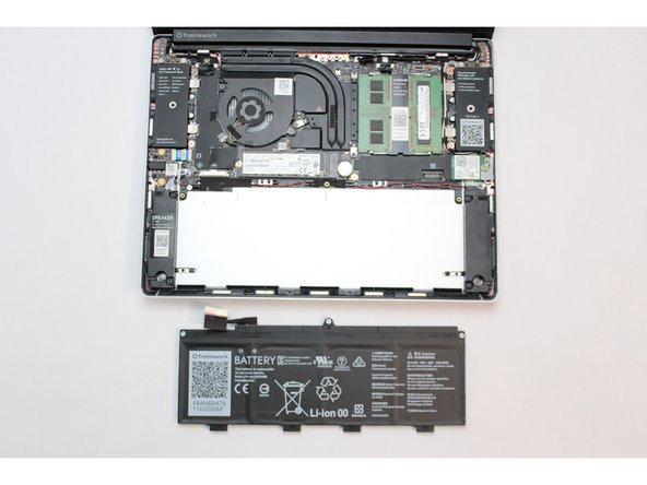 Warning: Handle the battery by the plastic frame, make sure not to bend, scratch, cut, or puncture it, and keep it away from heat sources