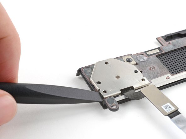 Use the flat end of your Framework Screwdriver to lift the fingerprint reader cover and remove it.