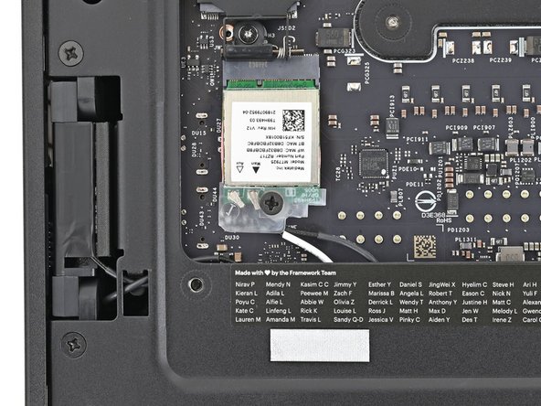 Use your Framework Desktop Screwdriver to install the screw securing the Wi-Fi module.