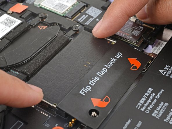 Use your fingers to spread the clips on both sides of the memory module apart to unclip the memory.