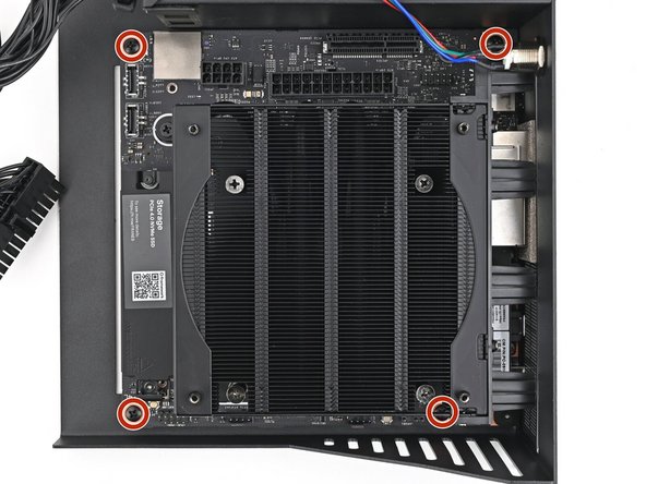 Use your Framework Desktop Screwdriver to install the four 8.2 mm‑long Phillips screws securing the Mainboard.