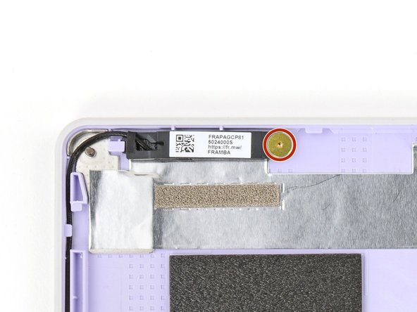 Use your Framework Screwdriver to remove the two (one per antenna) 2.5 mm‑long T5 Torx screws securing the antennas to the Top Cover.