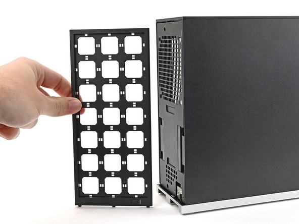 Use your fingers to pull the Front Panel off the magnets securing it to the chassis.