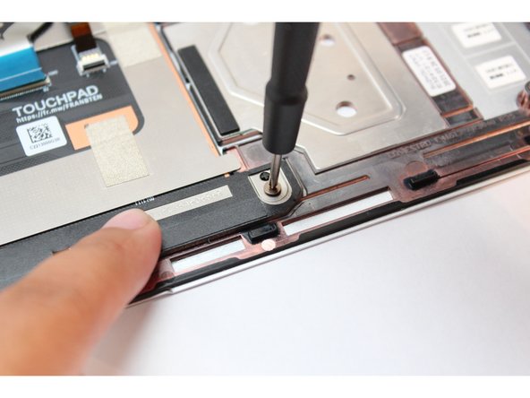 Using the PH0 bit in the Framework Screwdriver, fasten the two remaining fasteners back into place.