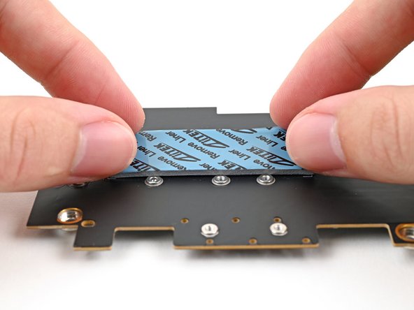 Place the thermal pad over its spot on the back of the adapter.