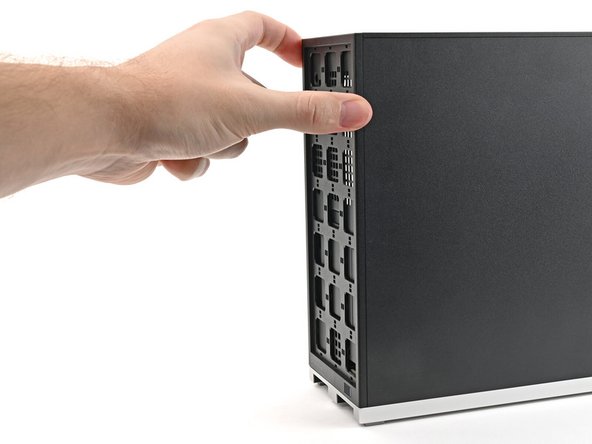 Use your fingers to pull the Front Panel off the magnets securing it to the chassis.