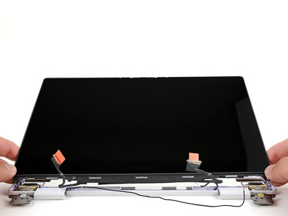 Lift and remove the display from the Top Cover.